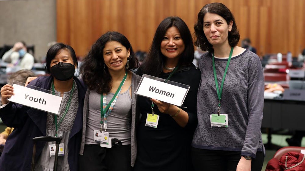 Women standing together at a conference