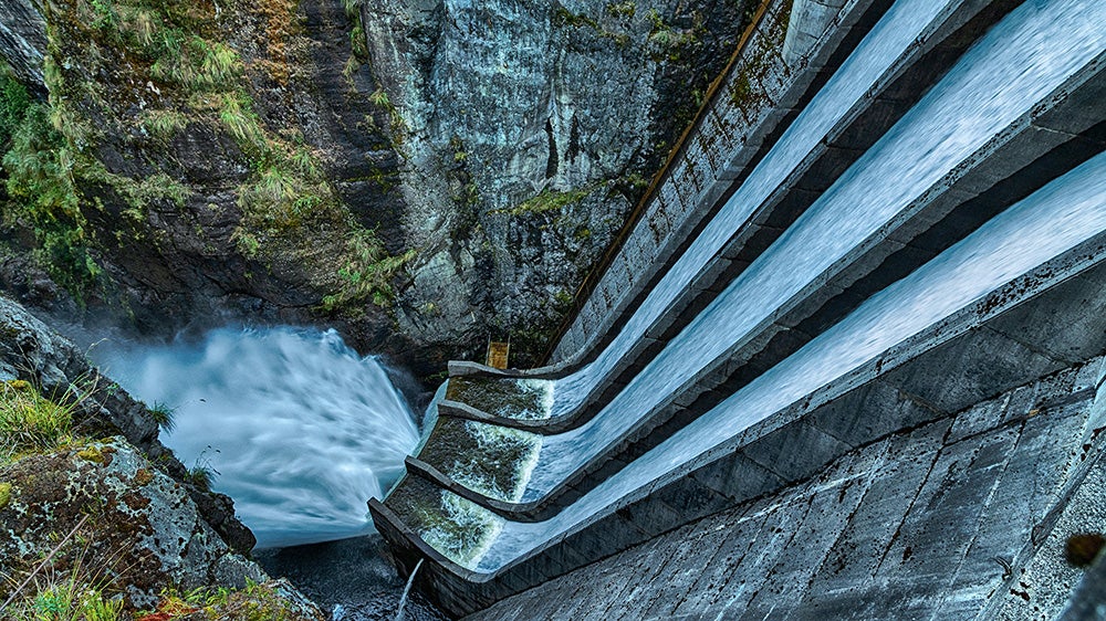 Long man-made dam waterfall