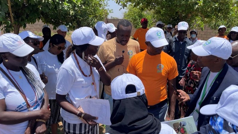 Senegalese women and men from a Global Environment Facility workshop conversing outside