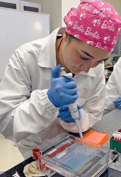 Girl in lab with pipette