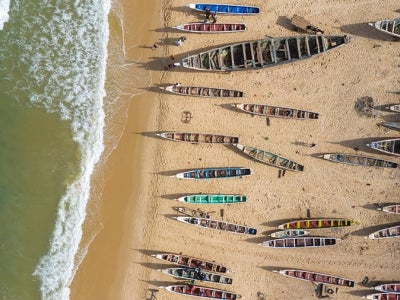 Aerial view of fishing village, pirogues fishing boats in Kayar, Senegal