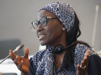 Madeleine Diouf Sarr, Senegalese woman, speaking into a microphone at an event