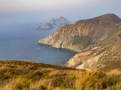 Landscape shot of rocky and grassy islands with ocean