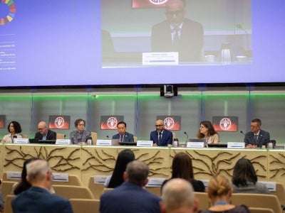 People speaking at a panel event