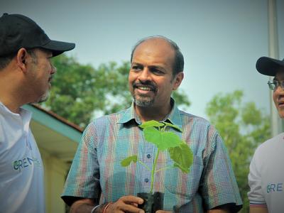 Dr. Nagulendran Kangayatkarasu at a tree planting event