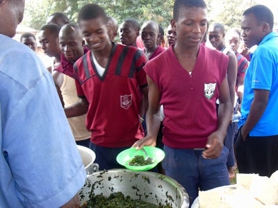 Kenyan students eating indigenous vegetables