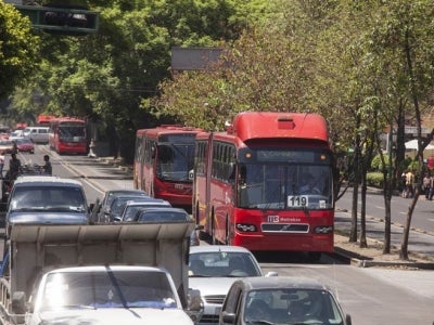 Mexico City BRT system alongside heavy traffic.