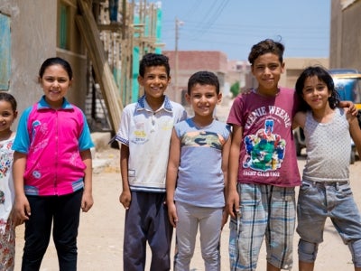 Smiling children in group photo, El-Saf, Egypt