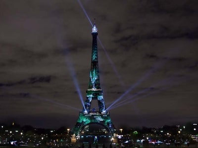 Art installation lights up Eiffel Tower on eve of Paris Climate talks. Photo: Elfred Tseng/Shutterstock.com