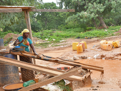 Woman processing gold in Burkina Faso