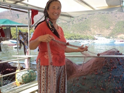 Turkish fisherwoman with nets