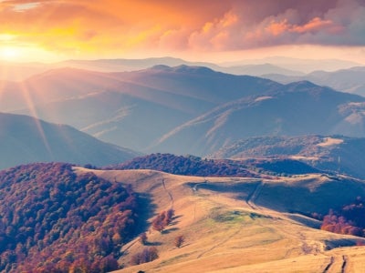 Colorful autumn sunrise in the Carpathian mountains. Krasna ridge, Ukraine, Europe.