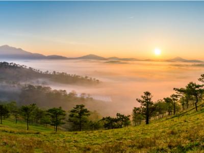 Sunrise near Da Lat City, Vietnam overlooking mountains and forests