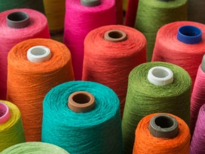 Colorful spools of fabric