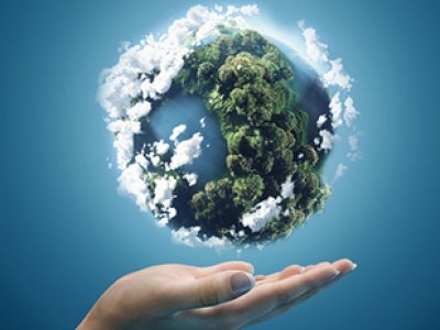 CG image of a human hand supporting planet Earth