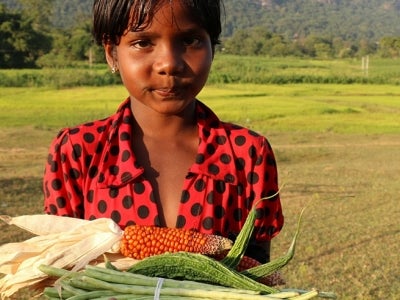 Girl holding crops