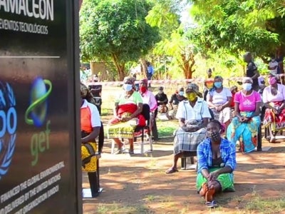 Mozambican women sit for a tablet presentation
