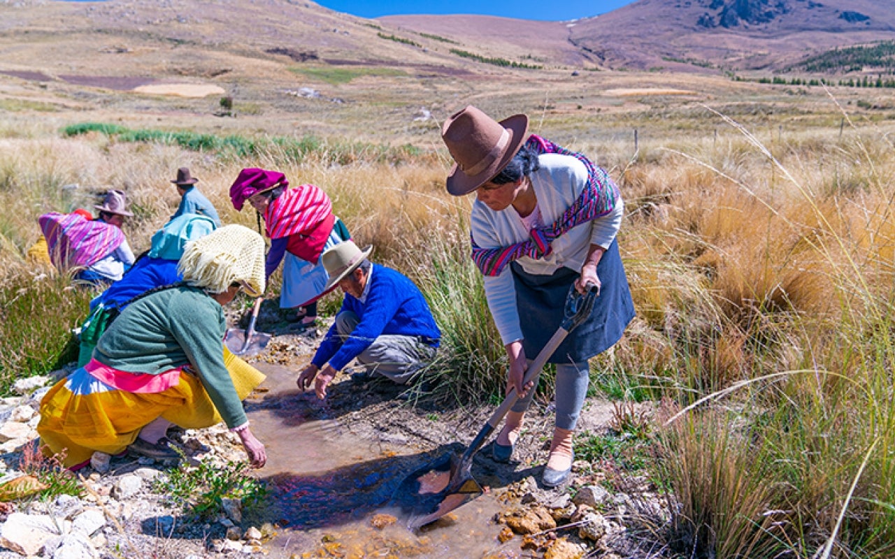 Communities in Huaraz work to maintain an irrigation canal