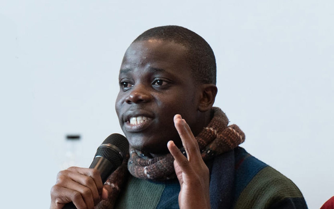 Beninese man speaking at an event