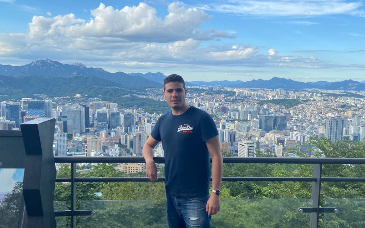 Man standing on a city overlook point
