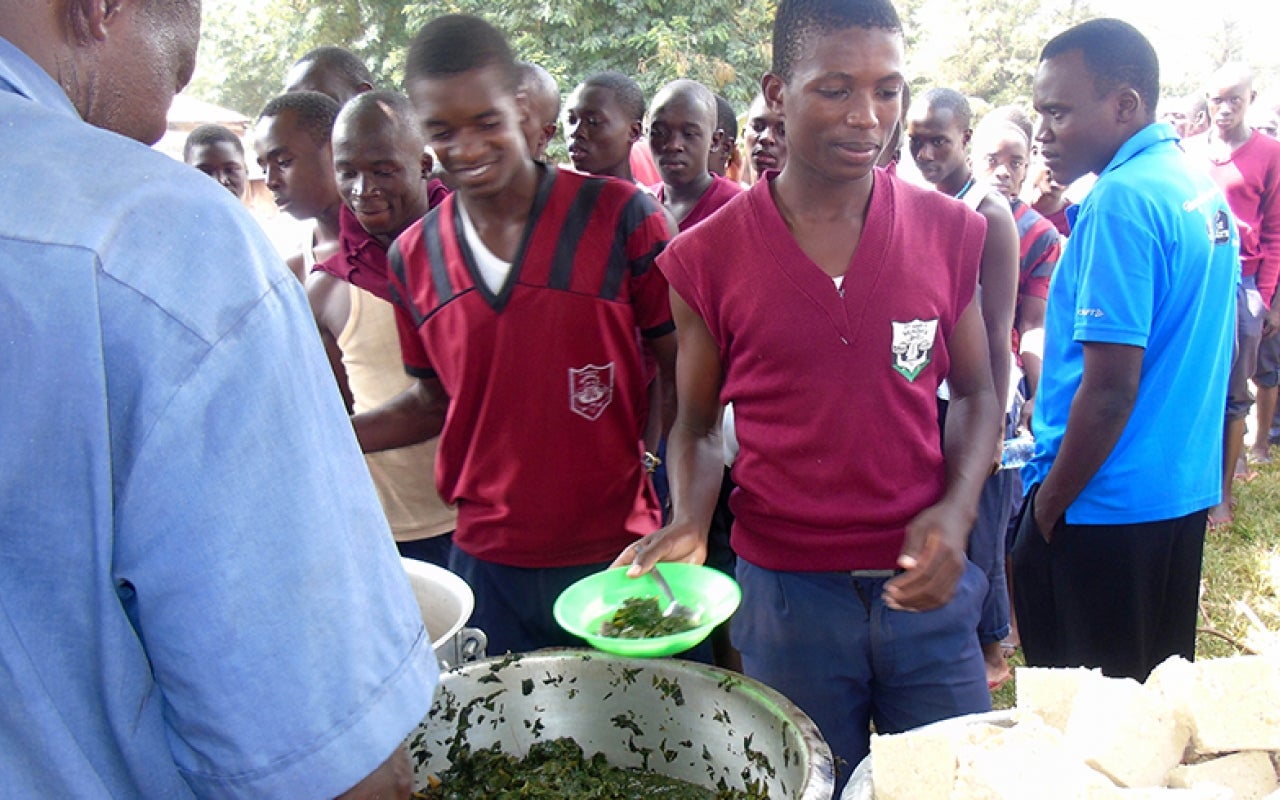 Kenyan students eating indigenous vegetables