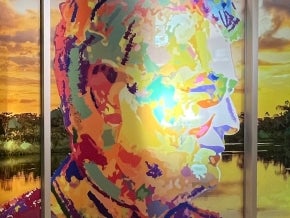 Colorful portrait and mural of Gustavo Fonseca in the Gustavo Fonseca Conference Room