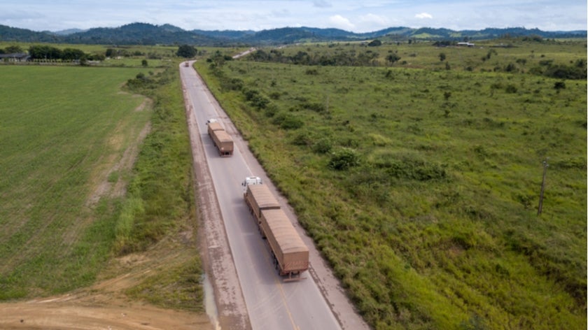 Trucks on a highway throught the Amazon forest in Brazil