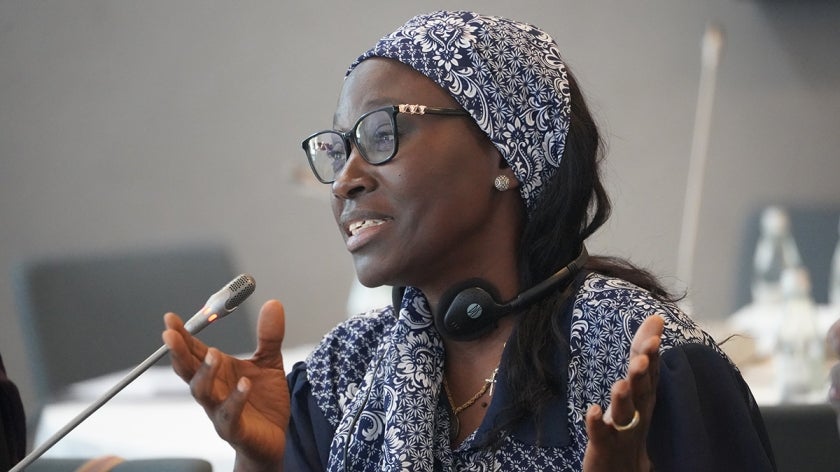 Madeleine Diouf Sarr, Senegalese woman, speaking into a microphone at an event