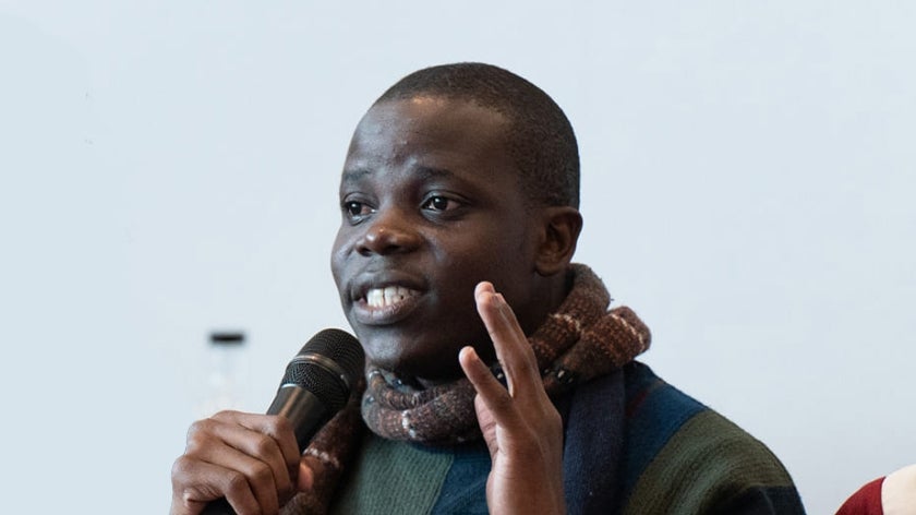 Beninese man speaking at an event