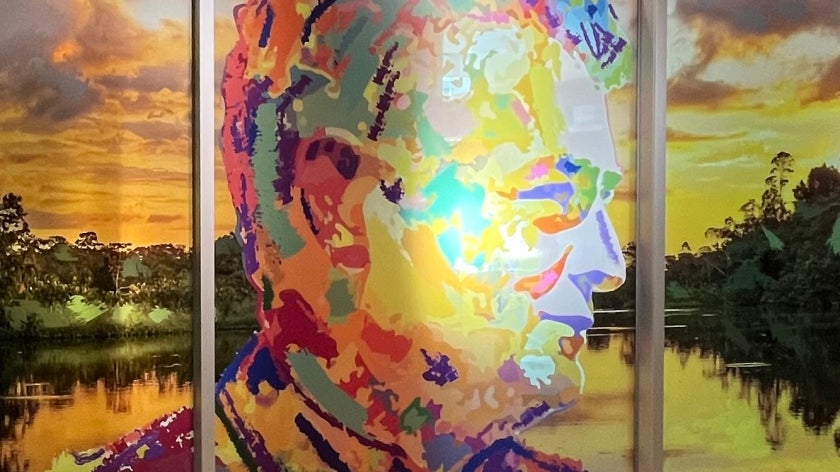 Colorful portrait and mural of Gustavo Fonseca in the Gustavo Fonseca Conference Room