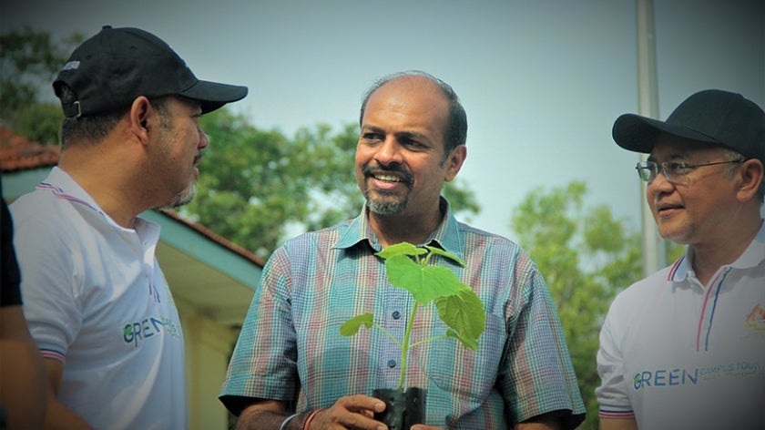 Dr. Nagulendran Kangayatkarasu at a tree planting event
