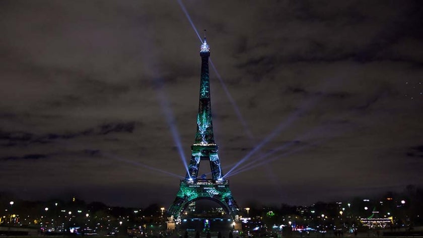 Art installation lights up Eiffel Tower on eve of Paris Climate talks. Photo: Elfred Tseng/Shutterstock.com